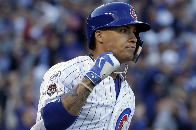 Chicago Cubs' Javier Baez (9) pumps his fist as he runs bases after hitting a three run home run against the St. Louis Cardinals National League Division Series, Tuesday, Oct. 13, 2015, in Chicago. (AP Photo/Nam Y. Huh)