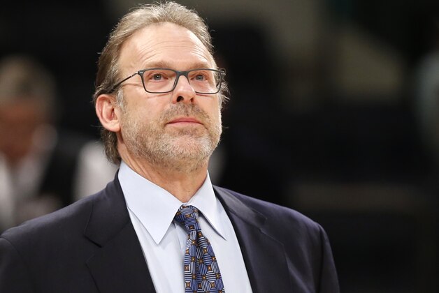 New York Knicks interim head coach Kurt Rambis, coaching his first game in place of Derek Fisher, who's was fired Monday, stands watches from the bench in the first half of an NBA basketball game between the New York Knicks and the Washington Wizards at Madison Square Garden in New York, Tuesday, Feb. 9, 2016. (AP Photo/Kathy Willens)