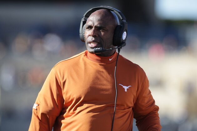 Texas head coach Charlie Strong during the first half/ second half of an NCAA college football game, Saturday, Nov. 14, 2015, in Morgantown, W.Va. (AP Photo/Raymond Thompson)