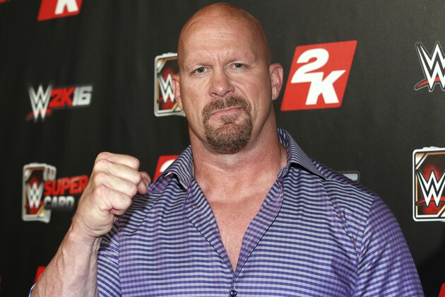 IMAGE DISTRIBUTED FOR 2K - WWE Hall of Famer and WWE 2K16 cover, Superstar Stone Cold Steve Austin arrives on the red carpet at the WWE 2K SummerSlam Kickoff in New York, N.Y., on Thursday, Aug. 20, 2015. (Photo by Stuart Ramson/Invision for 2K/AP Images)