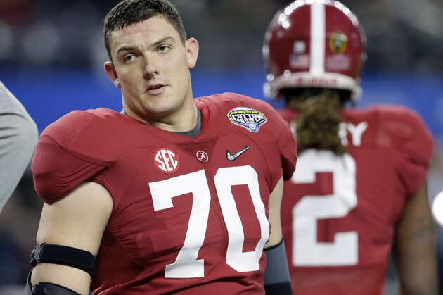Alabama offensive lineman Ryan Kelly (70) warms up before the Cotton Bowl NCAA college football semifinal playoff game against Michigan State, Thursday, Dec. 31, 2015, in Arlington, Texas. (AP Photo/LM Otero)