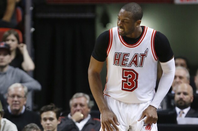 Miami Heat guard Dwyane Wade (3) grimaces after a play during the second half of an NBA basketball game against the San Antonio Spurs, Tuesday, Feb. 9, 2016, in Miami. The Spurs defeated the Heat 119-101. (AP Photo/Wilfredo Lee)