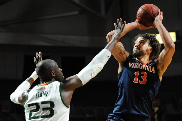 Feb 22, 2016; Coral Gables, FL, USA; Virginia Cavaliers forward Anthony Gill (13) shoots in the first half over Miami Hurricanes center Tonye Jekiri (23) at BankUnited Center. Mandatory Credit: Robert Duyos-USA TODAY Sports