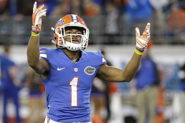 Florida defensive back Vernon Hargreaves, III (1) raises his arms to fans to cheer louder during the second half of an NCAA college football game against Georgia in Jacksonville, Fla., Saturday, Nov. 1, 2014. Florida won 38-20. (AP Photo/John Raoux)