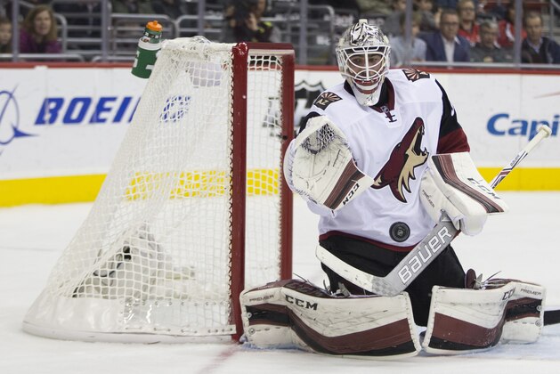 Arizona Coyotes goalie Louis Domingue (35) makes a save against the Washington Capitals during the second period of an NHL hockey game, on Monday, Feb. 22, 2016, in Washington. (AP Photo/Evan Vucci)