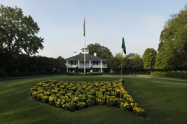 The sun rises over the Augusta National Golf Club house  before practice rounds for the Masters golf tournament Wednesday, April 4, 2012, in Augusta, Ga. (AP Photo/Darron Cummings)