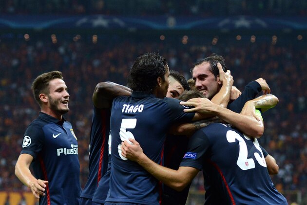 Atletico Madrid's Antoine Griezmann (unseen) celebrates with his team mates after scoring the second goal during the Champions League group C football match Galatasaray vs Atletico Madrid on September 15, 2015 at the TT Arena Stadium in Istanbul. AFP PHOTO / OZAN KOSE        (Photo credit should read OZAN KOSE/AFP/Getty Images)