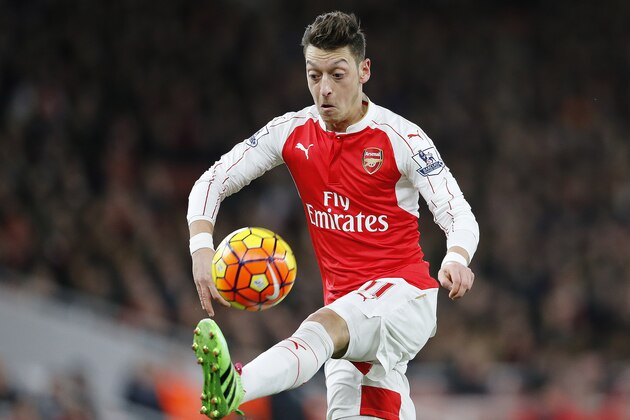 Arsenal's Mesut Ozil stops the ball during the English Premier League soccer match between Arsenal and Southampton at the Emirates stadium in London, Tuesday, Feb. 2, 2016. (AP Photo/Frank Augstein)
