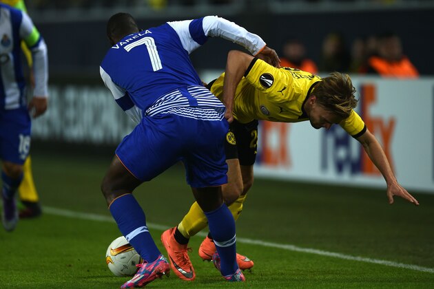 Dortmund's defender Marcel Schmelzer (R) vies with Porto´s Silvestre Varela during the UEFA Europa League Round of 32 football match between Borussia Dortmund and FC Porto in Dortmund, western Germany on February 18, 2016. 

 / AFP / PATRIK STOLLARZ        (Photo credit should read PATRIK STOLLARZ/AFP/Getty Images)
