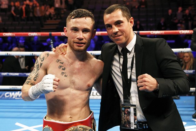 IBF world champion Carl Frampton, left, poses for a photo with WBA world super bantamweight champion Scott Quigg after defeating Chris Avalos of the U.S. during their IBF super bantamweight world boxing title fight at the Odyssey arena in Belfast, Northern Ireland, Saturday, Feb. 28, 2015. (AP Photo/Peter Morrison)
