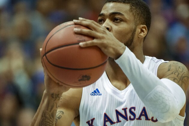 Kansas Jayhawks guard Frank Mason III (0) prepares to shoot after a technical foul against the Kansas State Wildcats during an NCAA college basketball game Wednesday, Feb. 3, 2016, in Lawrence, Kan. Kansas  beat K-State, 77-59. (AP Photo/Reed Hoffmann)