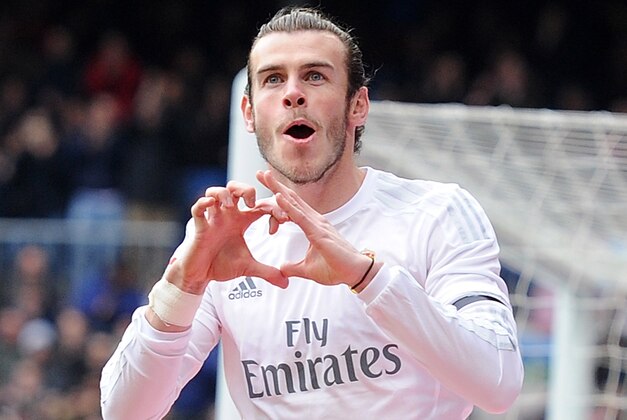 MADRID, SPAIN - JANUARY 17:  Gareth Bale of Real Madrid celebrates after scoring his team's opening goal during the La Liga match between Real Madrid CF and Sporting Gijon at Estadio Santiago Bernabeu on January 17, 2016 in Madrid, Spain.  (Photo by Denis Doyle/Getty Images)