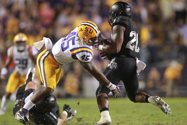 Nov 28, 2015; Baton Rouge, LA, USA; LSU Tigers linebacker Deion Jones (45) tackles Texas A&M Aggies running back James White (20) during the second half at Tiger Stadium. LSU defeated Texas A&M Aggies 19-7. Mandatory Credit: Crystal LoGiudice-USA TODAY Sports
