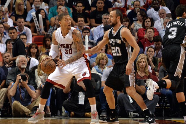Mar 31, 2015; Miami, FL, USA; Miami Heat forward Michael Beasley (30) is pressured by San Antonio Spurs guard Manu Ginobili (20) during the second half at American Airlines Arena. Mandatory Credit: Steve Mitchell-USA TODAY Sports