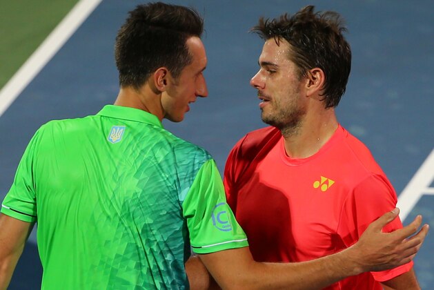 Sergiy Stakhovsky (L) of Ukraine congratulates Stan Wawrinka of Switzerland after he won their ATP tennis match in the second round of the Dubai Open Tennis Championships on February 23, 2016.
Wawrinka won the match 5-7, 6-3, 7-5. / AFP / MARWAN NAAMANI        (Photo credit should read MARWAN NAAMANI/AFP/Getty Images)