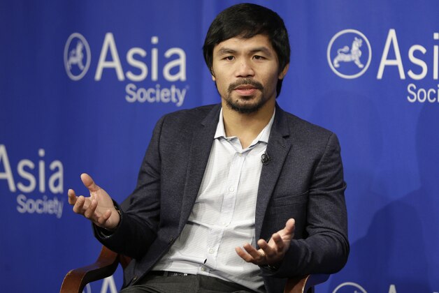 FILE - In this Oct. 12, 2015, file photo, Manny Pacquiao takes questions at the Asia Society in New York. Boxing star Pacquiao has created a firestorm in his home country after saying people in same-sex relationships “are worse than animals.” Pacquiao, who is running for a Philippine Senate seat, made the remark in a video posted Monday, Feb. 15, 2016, on local TV5’s election site. He also said animals are better than people in same-sex relationships because they recognize the difference between males and females. (AP Photo/Seth Wenig, File)