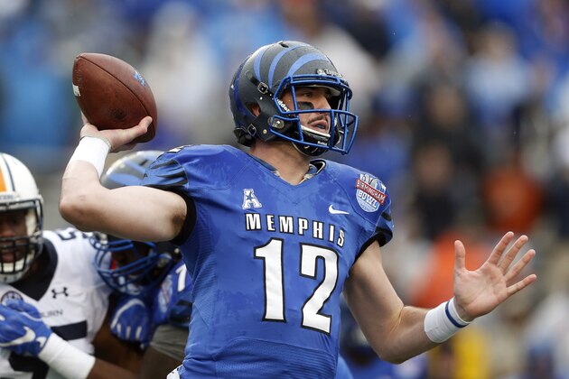 Memphis quarterback Paxton Lynch (12) throws a pass during the first half of the Birmingham Bowl NCAA college football game against Auburn Auburn, Wednesday, Dec. 30, 2015, in Birmingham, Ala. (AP Photo/Butch Dill)