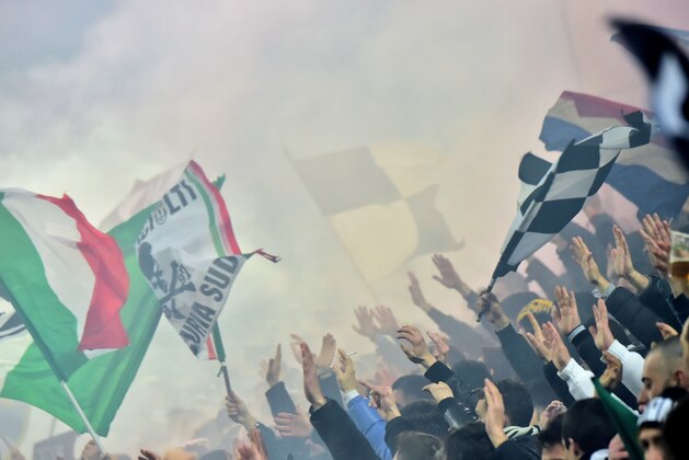 Juventus' supporters cheer for their team ahead of the UEFA Champions League round of 16 first leg football match between Juventus and Bayern Munich at the Juventus Stadium in Turin on February 23, 2016. AFP PHOTO / GIUSEPPE CACACE / AFP / GIUSEPPE CACACE        (Photo credit should read GIUSEPPE CACACE/AFP/Getty Images)