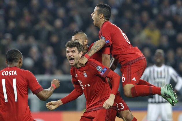 Bayern's Thomas Mueller, center, celebrates after scoring the opening goal during the Champions League, round of 16, first-leg soccer match between Juventus and Bayern Munich at the Juventus stadium in Turin, Italy, Tuesday, Feb. 23, 2016. (AP Photo/Luca Bruno)