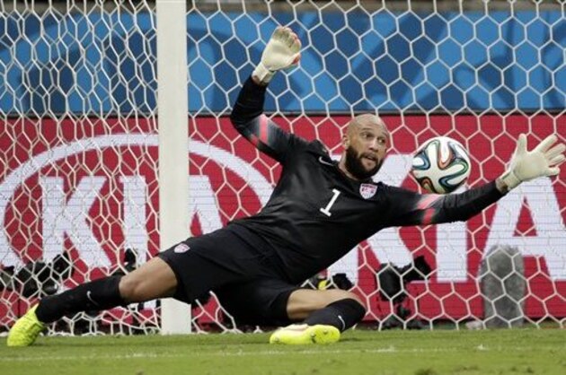 FILE - In this July 1, 2014, file photo, United States' goalkeeper Tim Howard saves a shot by Belgium during a World Cup round of 16 soccer match at the Arena Fonte Nova in Salvador, Brazil. Howard has won the 2014 Player of the Year award on Thursday, Dec. 4, 2014, for his work with the U.S. national team. It is the first time Howard has won the prestigious honor given to a U.S. team member by Futbol de Primera.  (AP Photo/Felipe Dana, File)