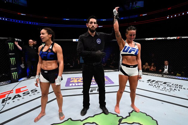 PITTSBURGH, PA - FEBRUARY 21:  (R-L) Ashlee Evans-Smith celebrates her victory over Marion Reneau in their women's bantamweight bout during the UFC Fight Night event at Consol Energy Center on February 21, 2016 in Pittsburgh, Pennsylvania. (Photo by Jeff Bottari/Zuffa LLC/Zuffa LLC via Getty Images)