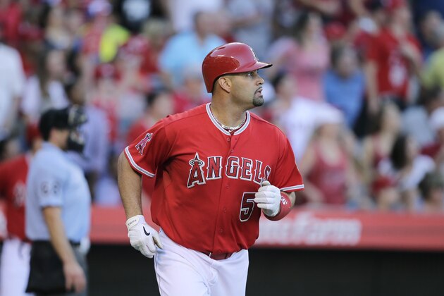 Los Angeles Angels' Albert Pujols watches his foul ball during the fifth inning of a baseball game against the Oakland Athletics, Wednesday, Sept. 30, 2015, in Anaheim, Calif. (AP Photo/Jae C. Hong)