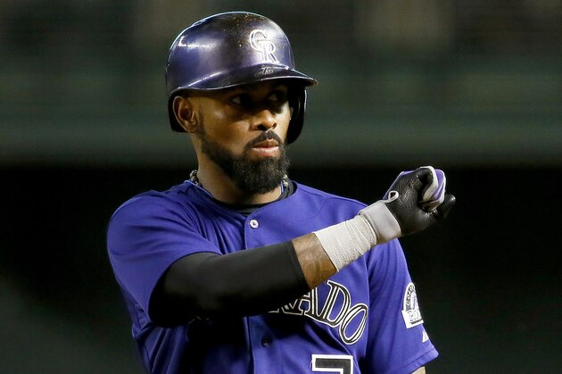 Colorado Rockies' Jose Reyes (7) gestures to his bench after a base hit during the first inning of a baseball game against the Arizona Diamondbacks, Tuesday, Sept. 29, 2015, in Phoenix. (AP Photo/Matt York)