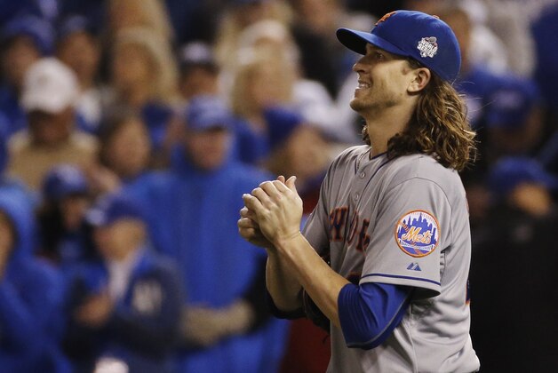 New York Mets pitcher Jacob deGrom looks at the scoreboard after giving up an RBI single to Kansas City Royals' Alcides Escobar during the fifth inning of Game 2 of the Major League Baseball World Series Wednesday, Oct. 28, 2015, in Kansas City, Mo. (AP Photo/Matt Slocum)