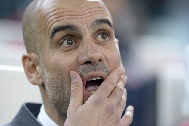 Bayern's head coach Pep Guardiola waits for the start of the Champions League, round of 16, first-leg soccer match between Juventus and Bayern Munich at the Juventus stadium in Turin, Italy, Tuesday, Feb. 23, 2016. (AP Photo/Massimo Pinca)