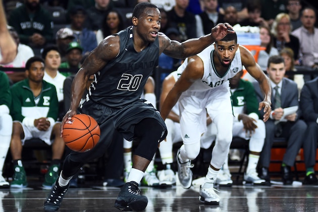 Nov 18, 2015; Rochester, MI, USA; Oakland Golden Grizzlies guard Kahlil Felder (20) drives to the basket against Eastern Michigan Eagles forward Jodan Price (5) during the first half at Athletics Center Orena. Mandatory Credit: Tim Fuller-USA TODAY Sports