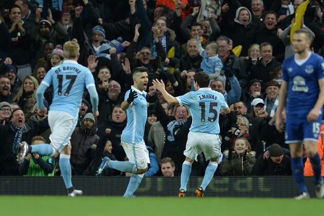 Manchester City's Argentinian striker Sergio Aguero (C) celebrates scoring his team's second goal during the English League Cup semi-final second leg football match between Manchester City and Everton the Etihad Stadium in Manchester, north west England, on January 27, 2016. / AFP / OLI SCARFF / RESTRICTED TO EDITORIAL USE. No use with unauthorized audio, video, data, fixture lists, club/league logos or 'live' services. Online in-match use limited to 75 images, no video emulation. No use in betting, games or single club/league/player publications.  /         (Photo credit should read OLI SCARFF/AFP/Getty Images)