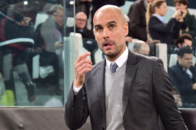 Bayern Munich's Spanish coach Pep Guardiola enters the pitch ahead of the UEFA Champions League round of 16 first leg football match between Juventus and Bayern Munich at the Juventus Stadium in Turin on February 23, 2016.  AFP PHOTO / GIUSEPPE CACACE / AFP / GIUSEPPE CACACE        (Photo credit should read GIUSEPPE CACACE/AFP/Getty Images)