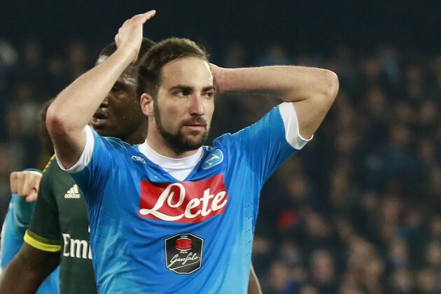 Napoli's Argentinian-French forward Gonzalo Higuain reacts after missing a goal during the Italian Serie A football match SSC Napoli vs AC Milan on February 22, 2016 at the San Paolo stadium in Naples. / AFP / CARLO HERMANN        (Photo credit should read CARLO HERMANN/AFP/Getty Images)