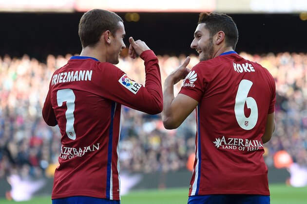 Atletico Madrid's midfielder Koke (R) celebrates with Atletico Madrid's French forward Antoine Griezmann after scoring during the Spanish league football match FC Barcelona vs Club Atletico de Madrid at the Camp Nou stadium in Barcelona on January 30, 2016. AFP PHOTO/ JOSEP LAGO / AFP / JOSEP LAGO (Photo credit should read JOSEP LAGO/AFP/Getty Images) Atletico Madrid's midfielder Koke (R) celebrates with Atletico Madrid's French forward Antoine Griezmann after scoring during the Spanish league football match FC Barcelona vs Club Atletico de Madrid at the Camp Nou stadium in Barcelona on January 30, 2016. AFP PHOTO/ JOSEP LAGO / AFP / JOSEP LAGO (Photo credit should read JOSEP LAGO/AFP/Getty Images)