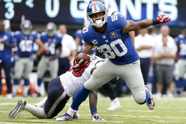 New York Giants wide receiver Victor Cruz (80) brings the all up field against the Houston Texans in the second quarter of an NFL football game, Sunday, Sept. 21, 2014, in East Rutherford, N.J. (AP Photo/Kathy Willens)