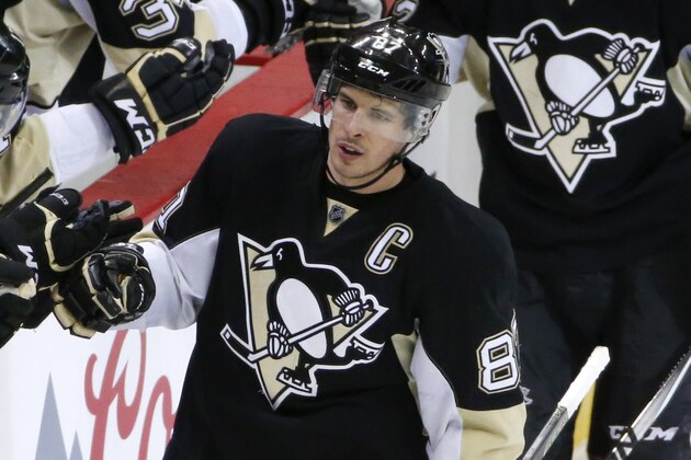 Pittsburgh Penguins' Sidney Crosby (87) returns to the bench after scoring an empty-net goal during the third period of the team's NHL hockey game against the Detroit Red Wings in Pittsburgh, Thursday, Feb. 18, 2016. The Penguins won 6-3. AP Photo/Gene J. Puskar)