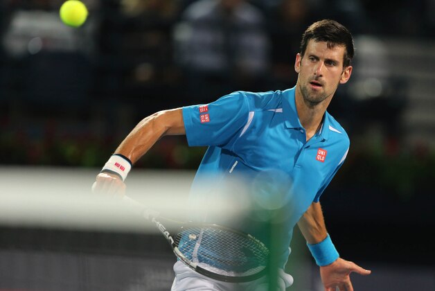 Novak Djokovic from Serbia returns the ball to Tommy Robredo from Spain during a first day match of the Dubai Tennis Championships in Dubai, United Arab Emirates, Monday, Feb. 22, 2016. (AP Photo/Kamran Jebreili)