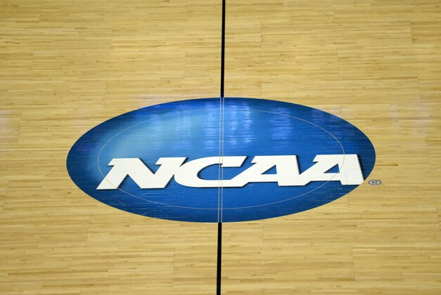 Mar 22, 2015; Seattle, WA, USA; General view of the NCAA logo at midcourt of the KeyArena during the game between the Northern Iowa Panthers  and Louisville Cardinals in the third round of the 2015 NCAA Tournament. Mandatory Credit: Kirby Lee-USA TODAY Sports