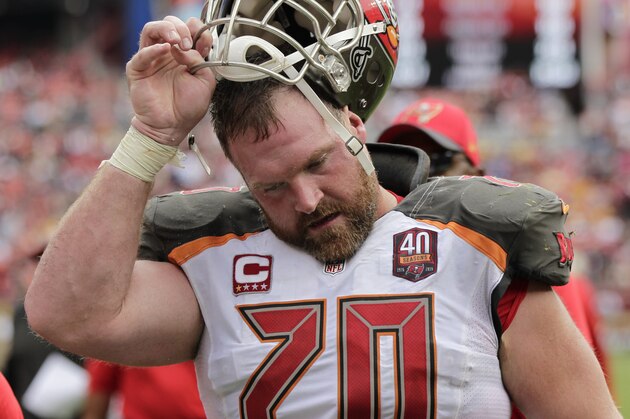 Tampa Bay Buccaneers guard Logan Mankins (70) pulls off this helmet as he leaves the field at halftime during an NFL football game against the Washington Redskins in Landover, Md., Sunday, Oct. 25, 2015. (AP Photo/Mark Tenally)
