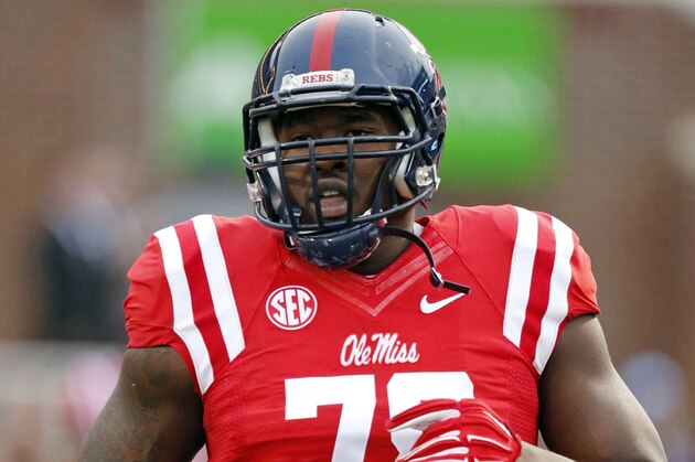 Mississippi offensive lineman Laremy Tunsil (78) loosens up prior to his team's NCAA college football game against Texas A&M in Oxford, Miss., Saturday, Oct. 24, 2015. Tunsil was making his first start for the season having served a seven game suspension. No. 24 Mississippi won 23-3.  (AP Photo/Rogelio V. Solis)