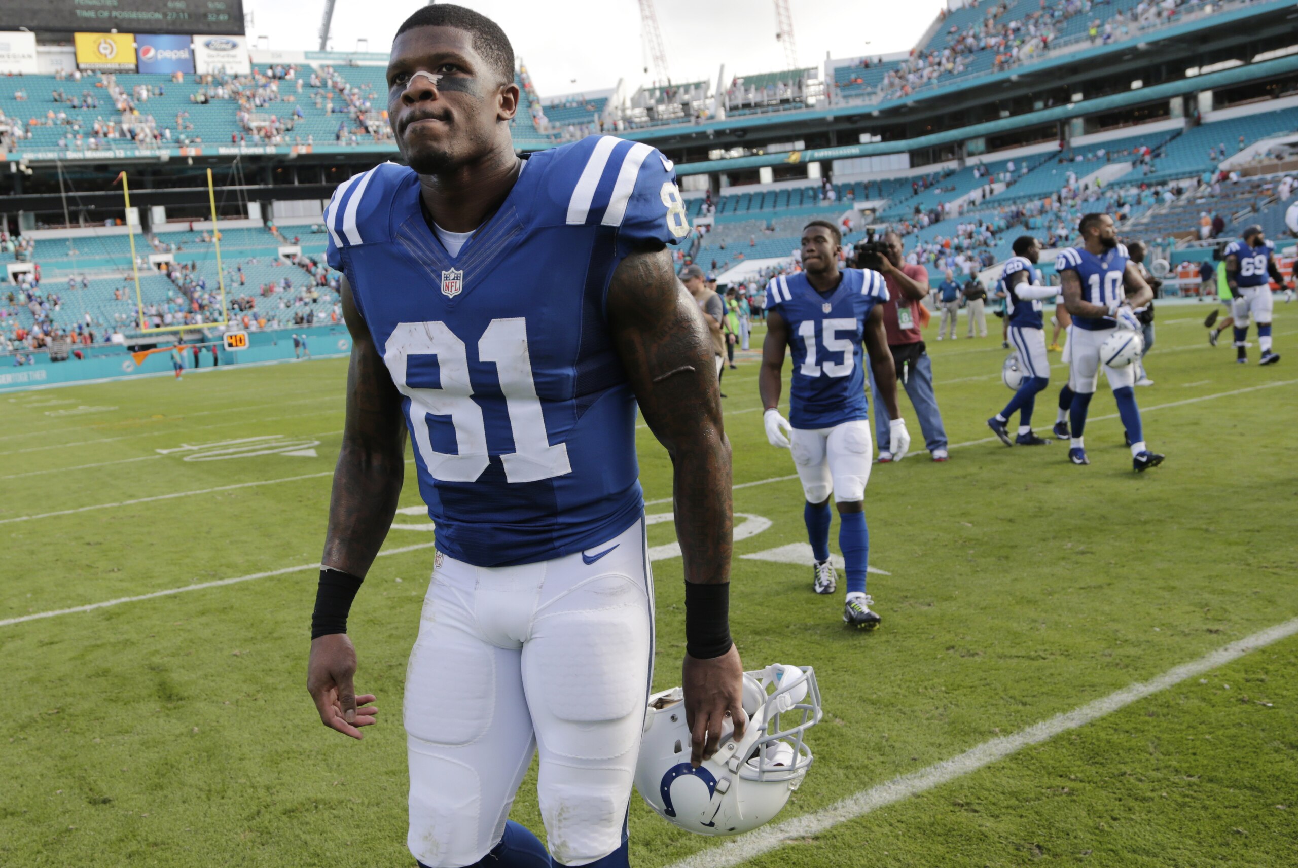 Indianapolis Colts wide receiver Andre Johnson (81) leaves the field at the end of an NFL football game against the Miami Dolphins, Sunday, Dec. 27, 2015, in Miami Gardens, Fla. The Colts defeated the Dolphins 18-12.  (AP Photo/Lynne Sladky)
