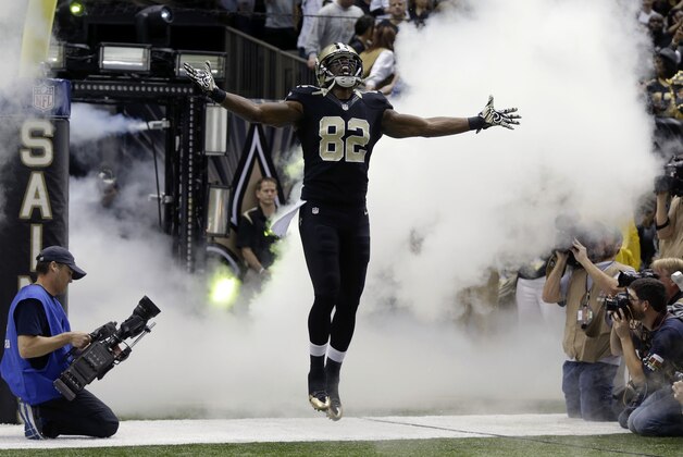 New Orleans Saints tight end Benjamin Watson (82) enters the field during pre-game introductions before an NFL football game against the Baltimore Ravensin New Orleans, Monday, Nov. 24, 2014. (AP Photo/Gerald Herbert)