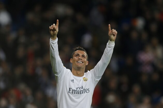 Real Madrid's Cristiano Ronaldo,left, celebrates after scoring his side's fifth goal during the Spanish La Liga soccer match between Real Madrid and Espanyol at the Santiago Bernabeu stadium in Madrid, Sunday, Jan. 31, 2016. (AP Photo/Francisco Seco)