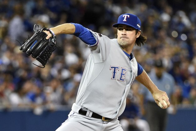 Oct 14, 2015; Toronto, Ontario, CAN; Texas Rangers starting pitcher Cole Hamels throws a pitch against the Toronto Blue Jays in the first inning in game five of the ALDS at Rogers Centre. Mandatory Credit: Peter Llewellyn-USA TODAY Sports