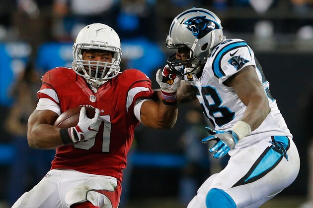 CHARLOTTE, NC - JANUARY 24:  David Johnson #31 of the Arizona Cardinals runs with the ball in the first half as Thomas Davis #58 of the Carolina Panthers defends him during the NFC Championship Game at Bank of America Stadium on January 24, 2016 in Charlotte, North Carolina.  (Photo by Kevin C. Cox/Getty Images)