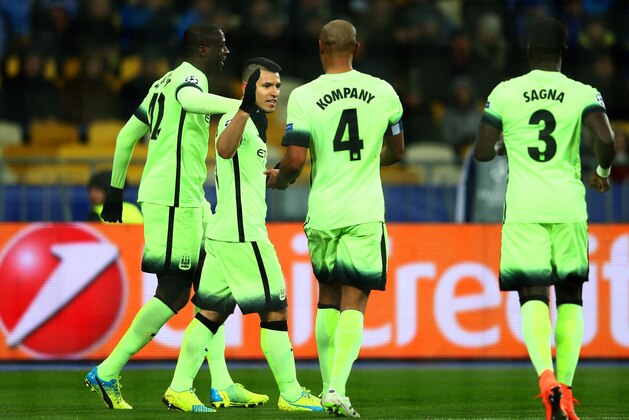 KIEV, UKRAINE - FEBRUARY 24:  Sergio Aguero of Manchester City is congratulated by teammates Yaya Toure and Vincent Kompany after scoring the opening goal during the UEFA Champions League round of 16, first leg match between FC Dynamo Kyiv and Manchester City FC at the Olympic Stadium on February 24, 2016 in Kiev, Ukraine.  (Photo by Michael Steele/Getty Images)