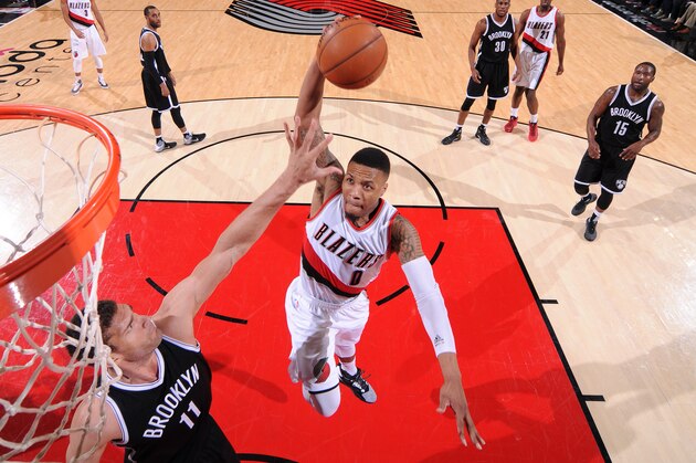 PORTLAND, OR - FEBRUARY 23: Damian Lillard #0 of the Portland Trail Blazers goes to the basket during the game against the Brooklyn Nets on February 23, 2016 at the Moda Center Arena in Portland, Oregon. NOTE TO USER: User expressly acknowledges and agrees that, by downloading and or using this photograph, user is consenting to the terms and conditions of the Getty Images License Agreement. Mandatory Copyright Notice: Copyright 2016 NBAE (Photo by Sam Forencich/NBAE via Getty Images)