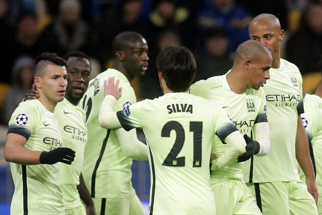 Manchester City's David Silva, center, is congratulated by teammates after scoring his side's 2nd goal during the Champions League round of 16 first leg soccer match between Dynamo Kiev and Manchester City at the Olympiyskiy stadium in Kiev, Ukraine, Wednesday, Feb. 24, 2016. (AP Photo/Efrem Lukatsky)