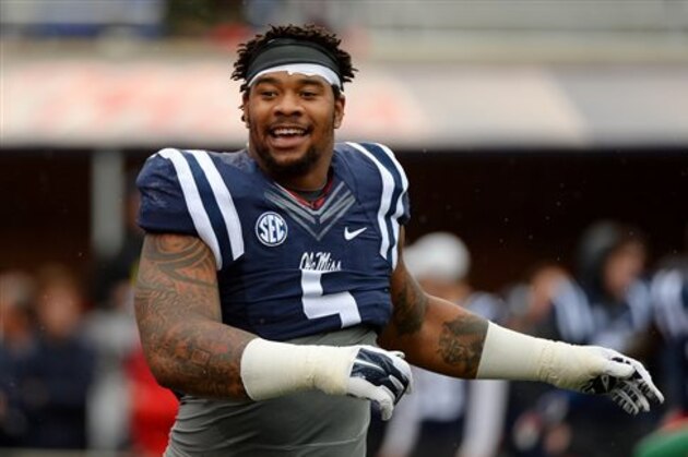 FILE - In this Nov. 7, 2015, file photo, Mississippi defensive tackle Robert Nkemdiche stretches before an NCAA college football game against Arkansas in Oxford, Miss. Nkemdiche, who was recently charged with marijuana possession after a 15-foot fall at an Atlanta hotel, will not play in the Sugar Bowl against Oklahoma State on Jan. 1, 2016, and will enter the NFL draft as a junior. (AP Photo/Thomas Graning, File)