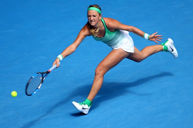 Victoria Azarenka of Belarus makes a forehand return to Angelique Kerber of Germany during their quarterfinal match at the Australian Open tennis championships in Melbourne, Australia, Wednesday, Jan. 27, 2016.(AP Photo/Rick Rycroft)